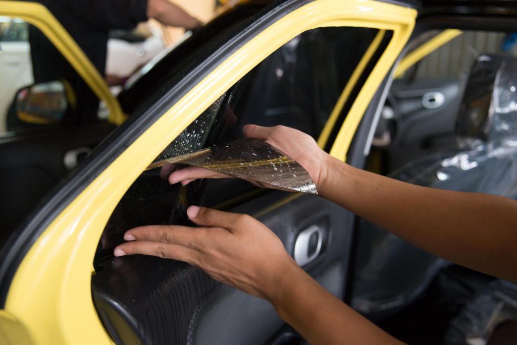 San Diego Car Wrap & Window Tinting - About someone installing tint on the car window